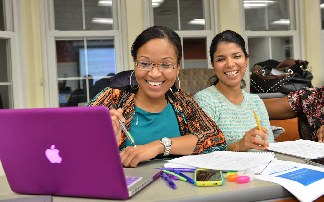 Two students working together on a project