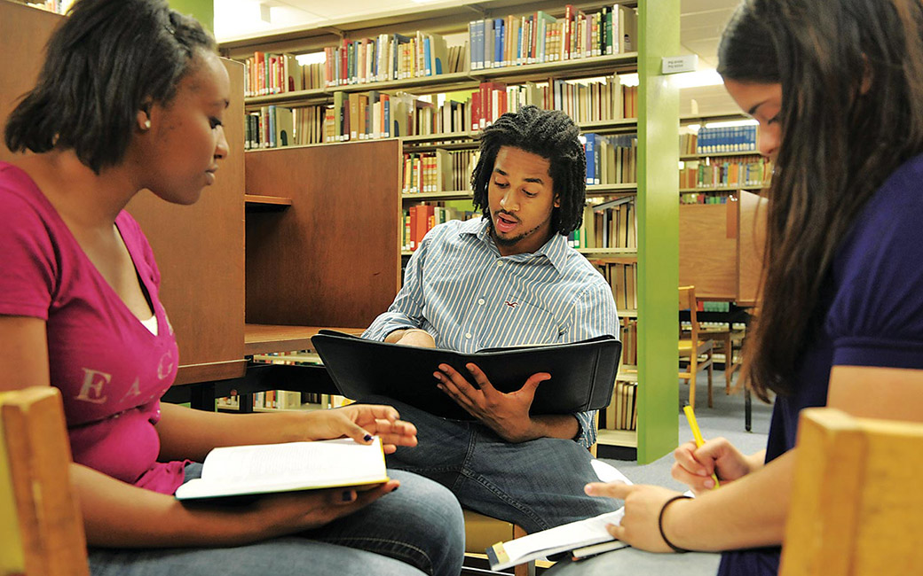 three students studying
