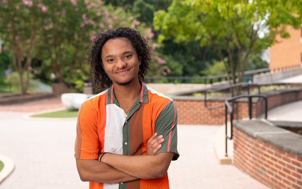 Daniel Kundrat standing in the middle of campus