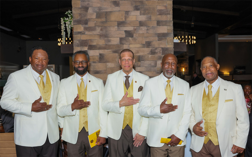 Men pose in suits
