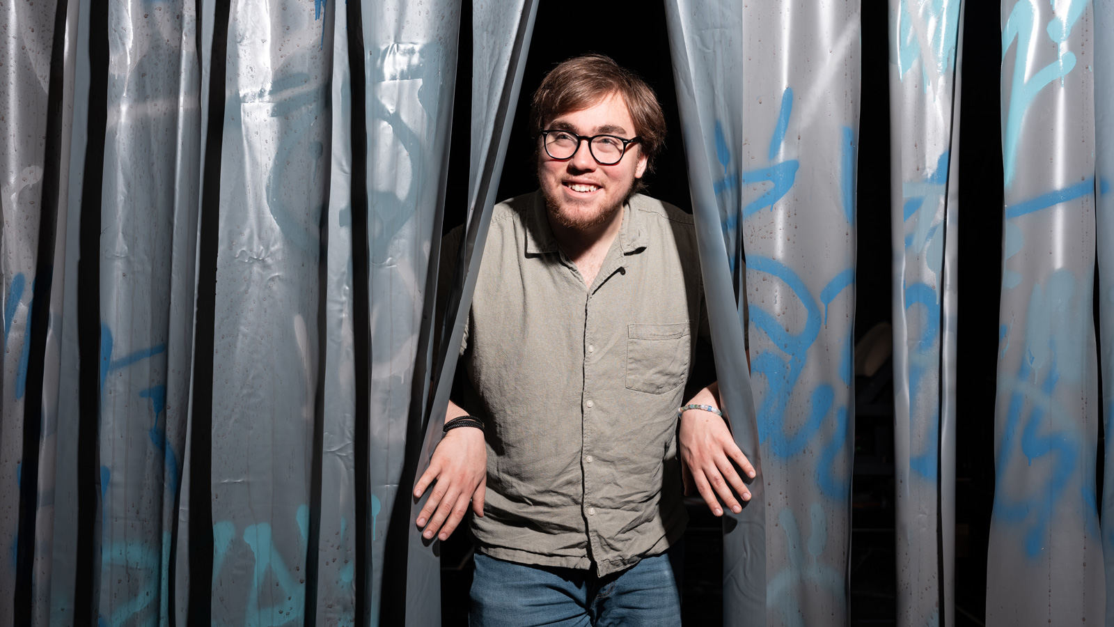 Wilson Seltzer taking a peak outside the Main Stage Theatre 