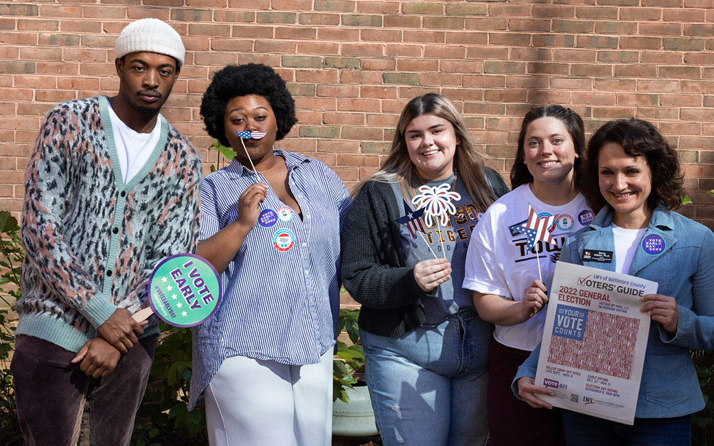 TU staff and faculty pose with election resources.